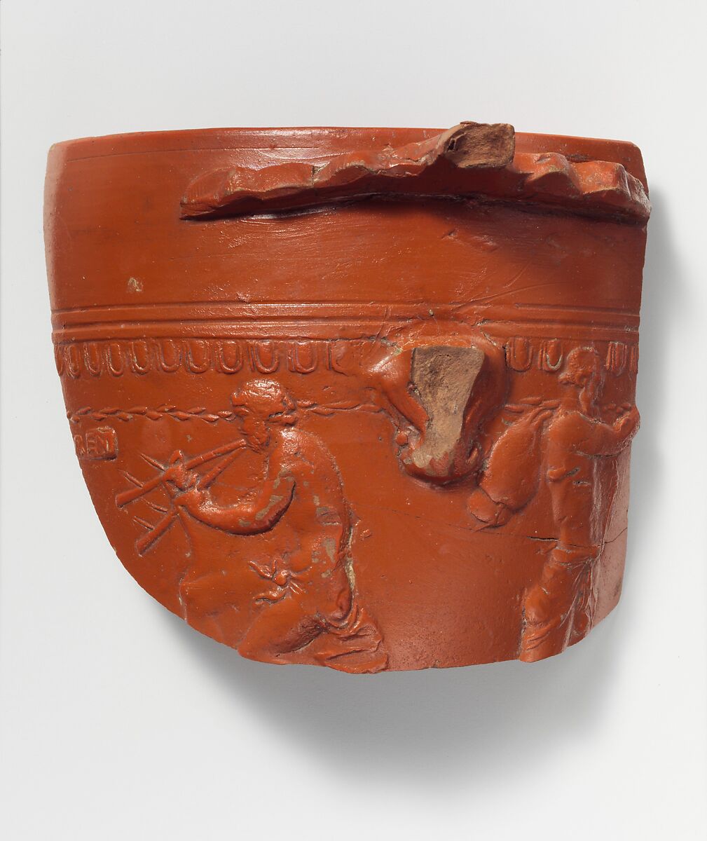 Terracotta fragment of an Arretine cup with satyrs, Signed by Perennius, Terracotta, Roman 