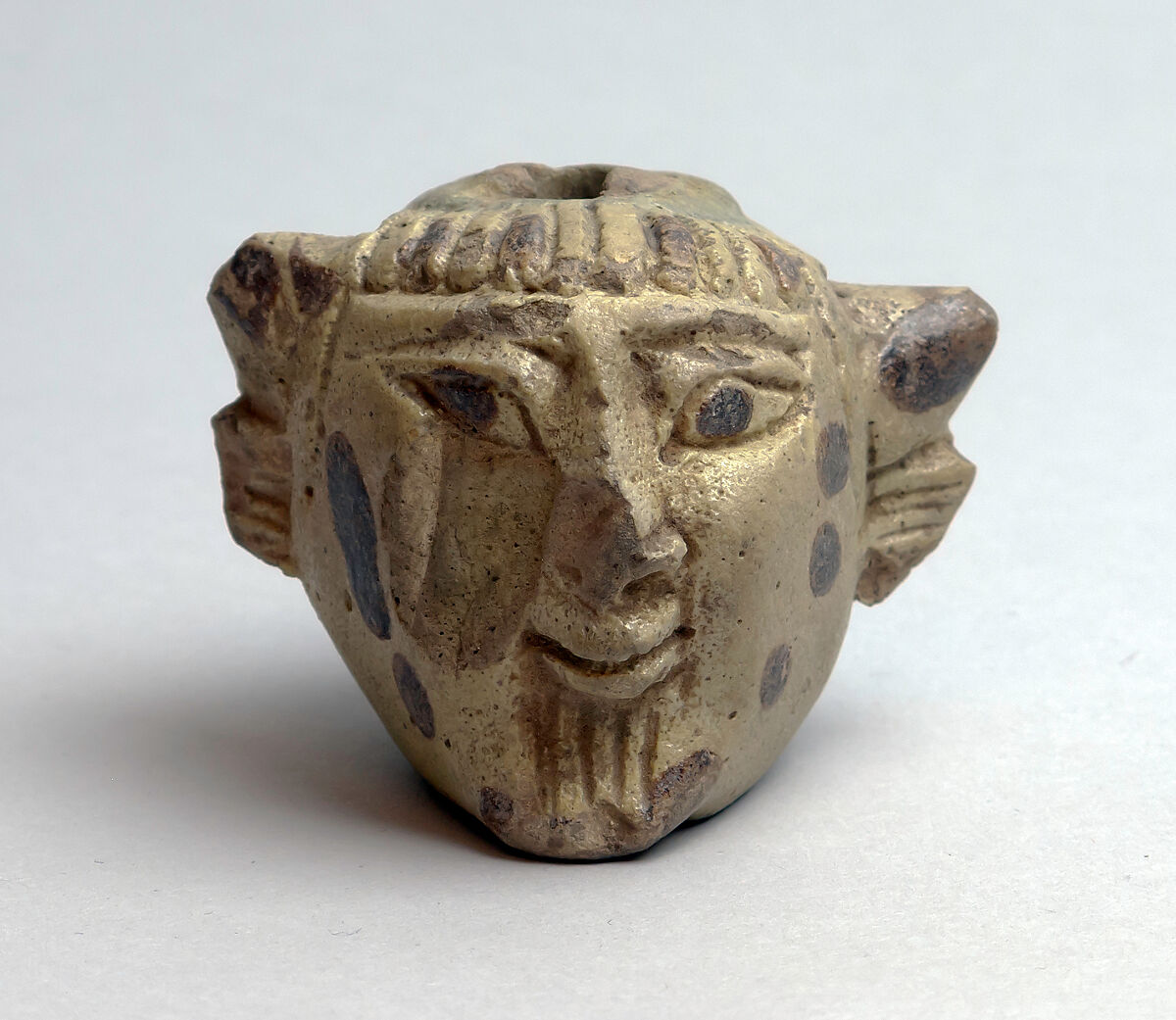 Faience aryballos (perfume vase) in the form of a head of Acheloös, Faience, East Greek 