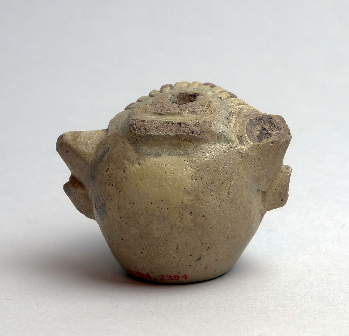 Faience aryballos (perfume vase) in the form of a head of Acheloös, Faience, East Greek