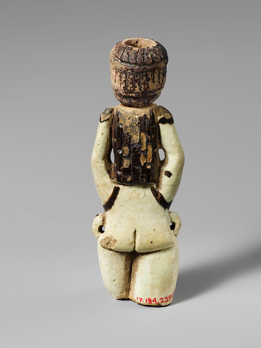 Fragment of a faience statuette of a woman holding a vase on her head, Faience, East Greek