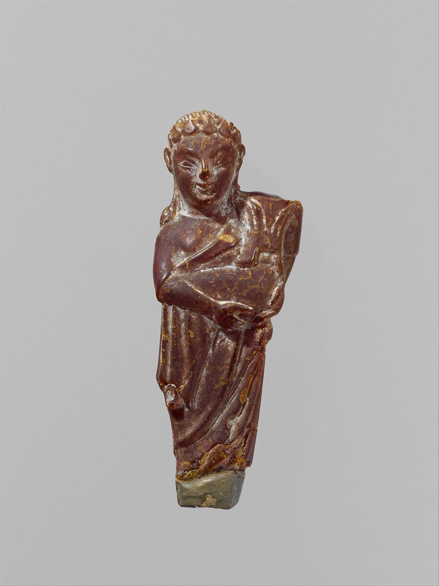 Pendant: woman carrying a child, Amber, Etruscan