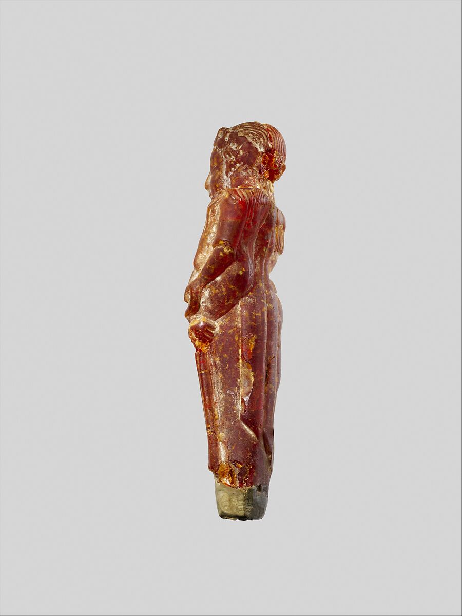Pendant: woman carrying a child, Amber, Etruscan