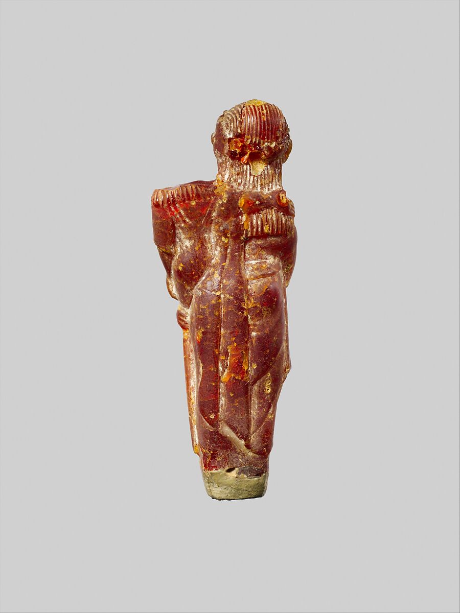 Pendant: woman carrying a child, Amber, Etruscan