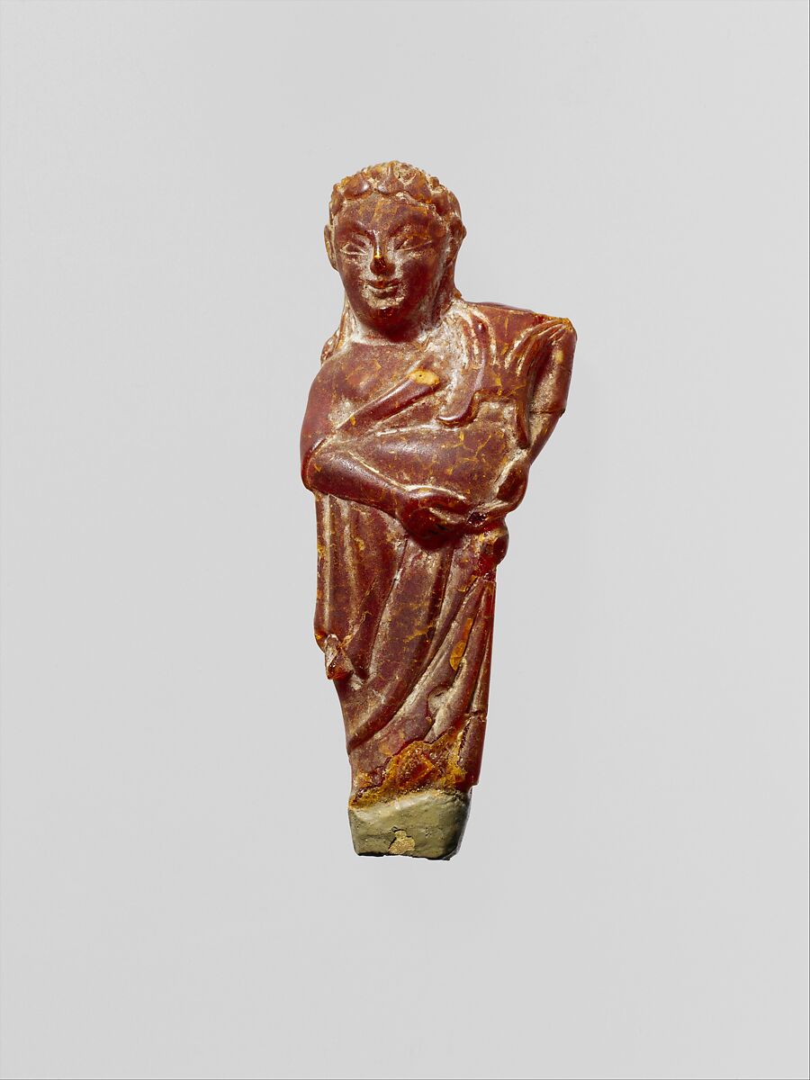 Pendant: woman carrying a child, Amber, Etruscan 