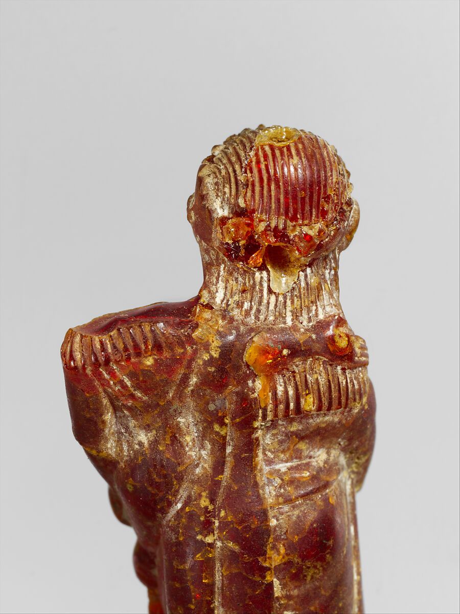Pendant: woman carrying a child, Amber, Etruscan