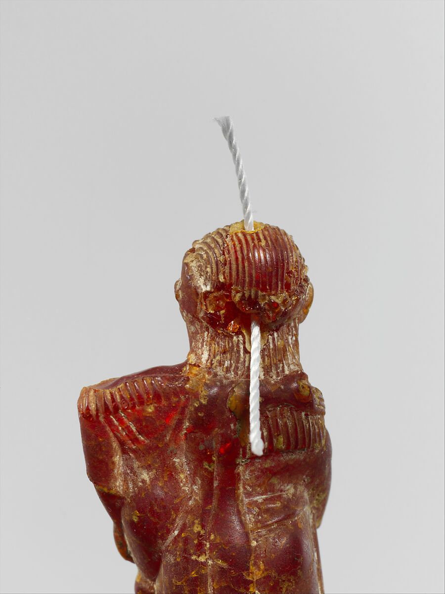 Pendant: woman carrying a child, Amber, Etruscan