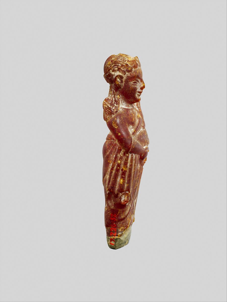 Pendant: woman carrying a child, Amber, Etruscan