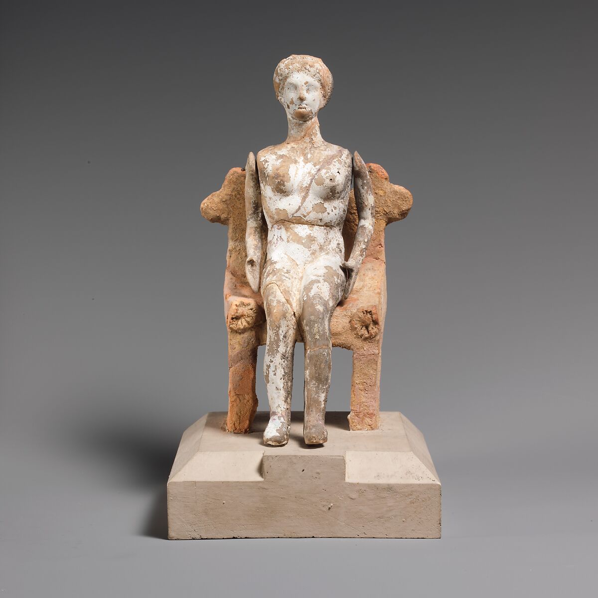 Terracotta doll with articulated arms seated on a chair, Terracotta, Greek, Attic 