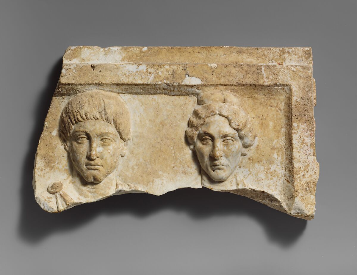 Top of a marble funerary relief with portrait busts of a young man and an elderly woman, Marble, Roman