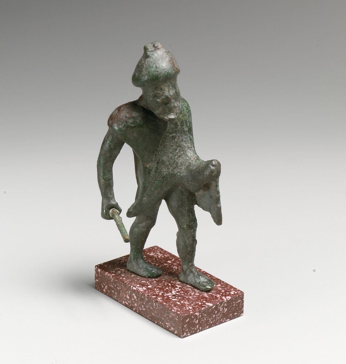 Statuette of a man with a stick, Bronze 