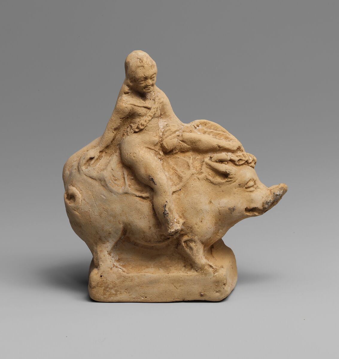 Terracotta statuette of Eros on a boar, Terracotta, Greek, South Italian 