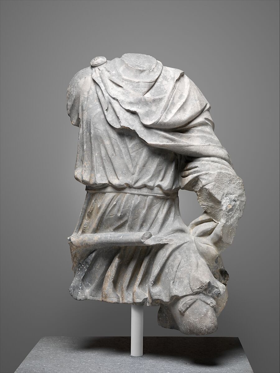 Limestone torso of a hunter, Black limestone, Roman 