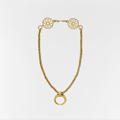 Gold necklace with crescent-shaped pendant