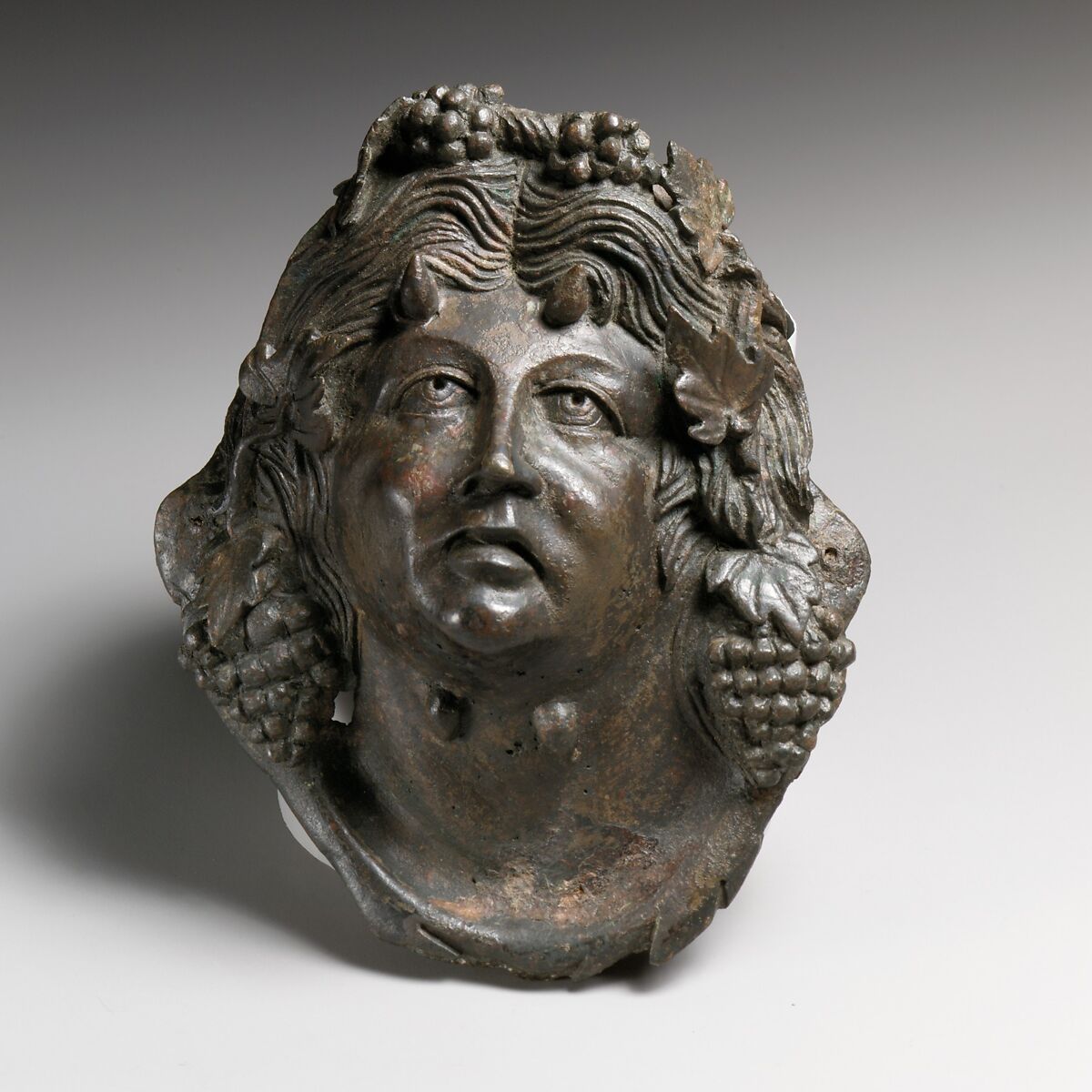 Bronze attachment in the form of the head of Pan, Bronze, Roman 