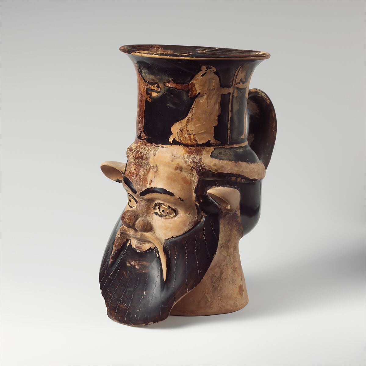 Terracotta mug in the form of a satyr's head, Attributed to the Carlsruhe Painter, Terracotta, Greek, Attic