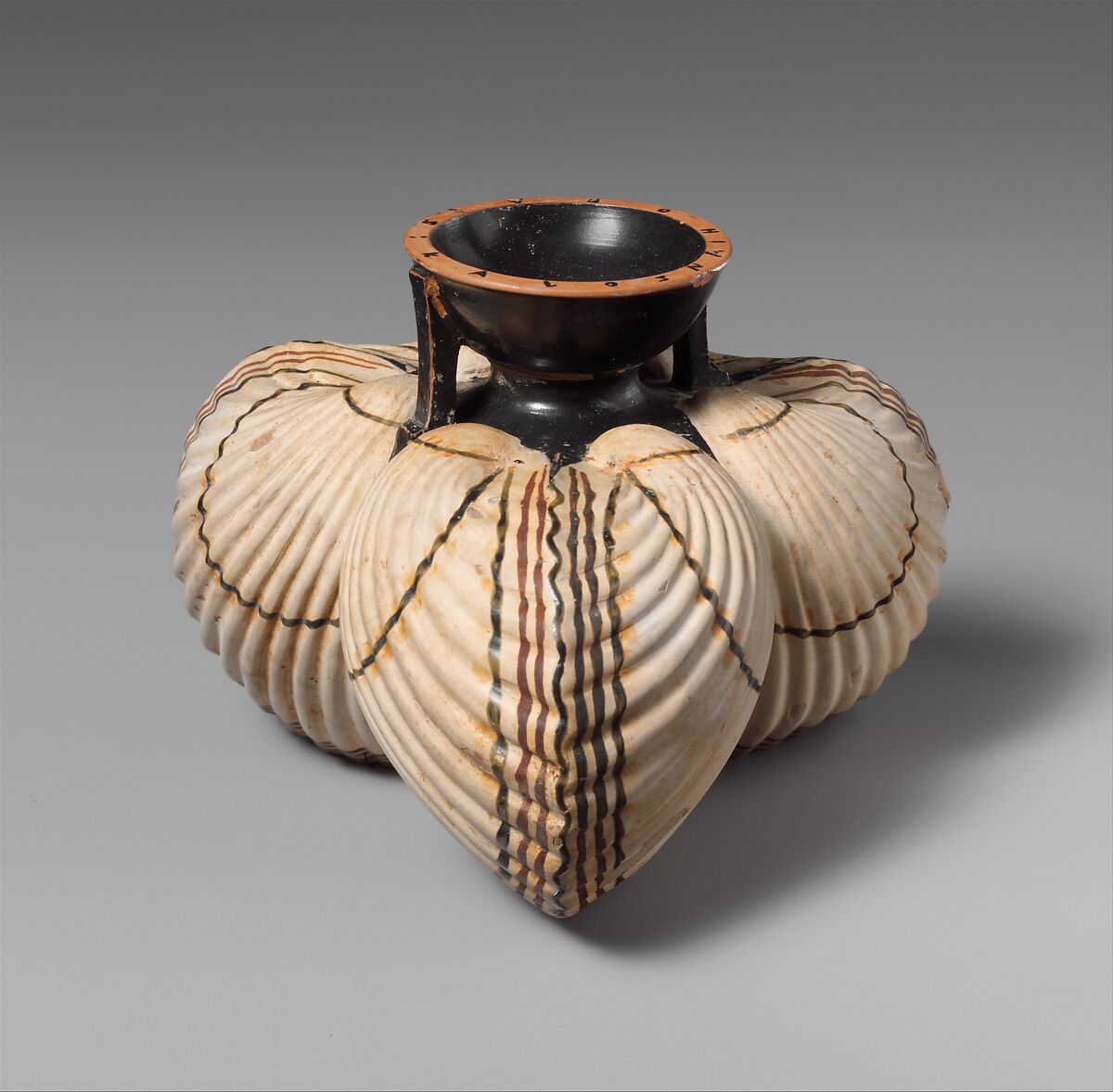 Terracotta aryballos (oil flask) in the form of three cockleshells, Terracotta, Greek, Attic 