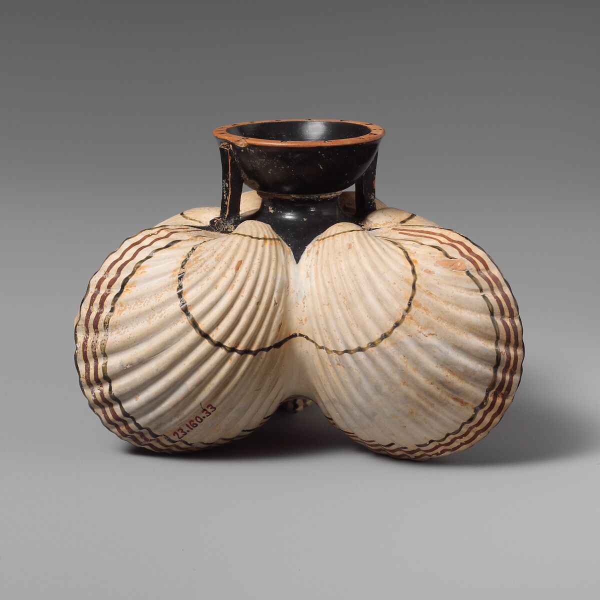 Terracotta aryballos (oil flask) in the form of three cockleshells, Terracotta, Greek, Attic