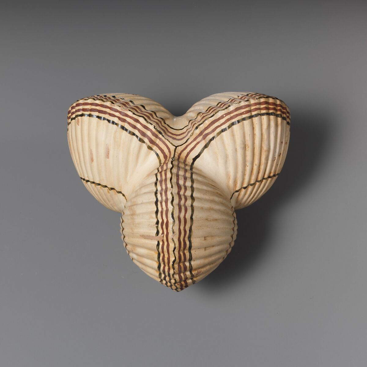 Terracotta aryballos (oil flask) in the form of three cockleshells, Terracotta, Greek, Attic