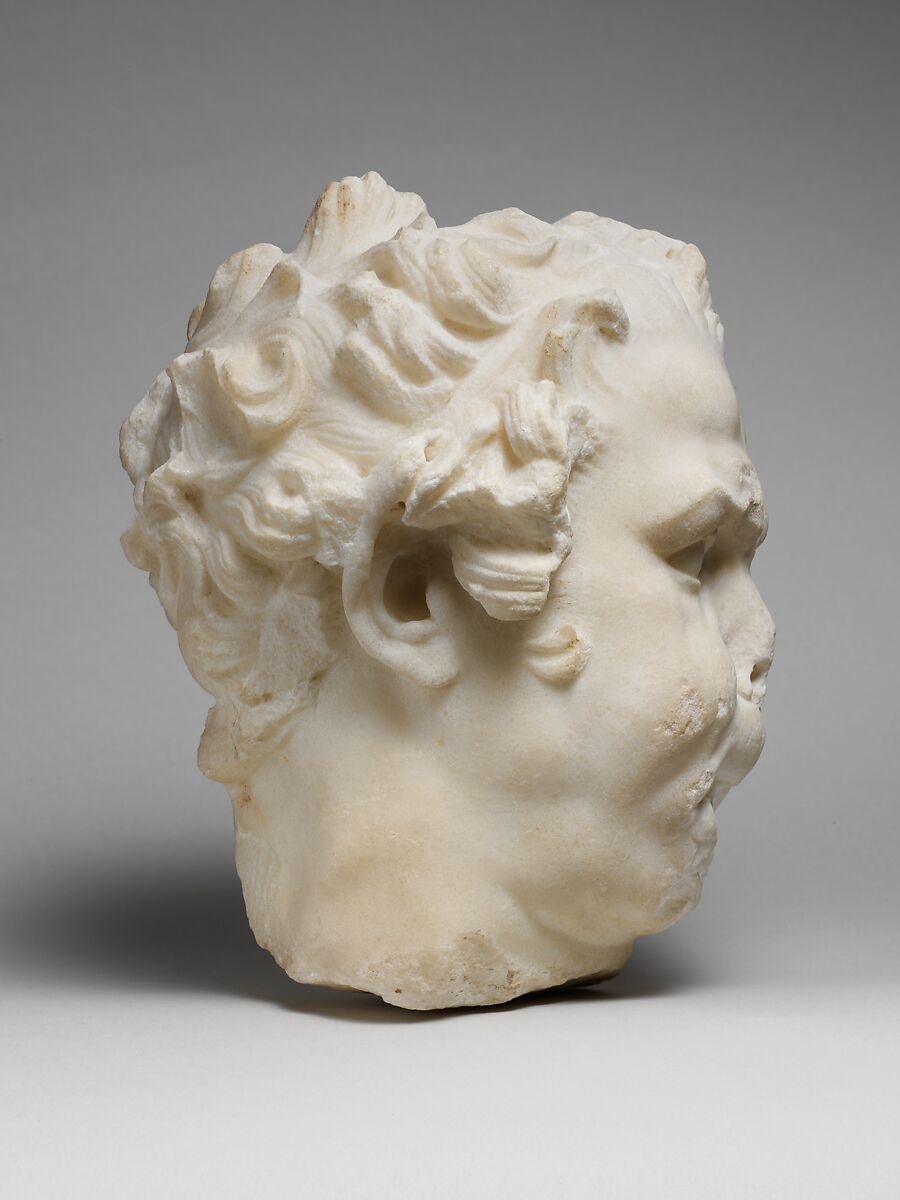 Marble head of a satyr playing the double flute, Marble, Roman