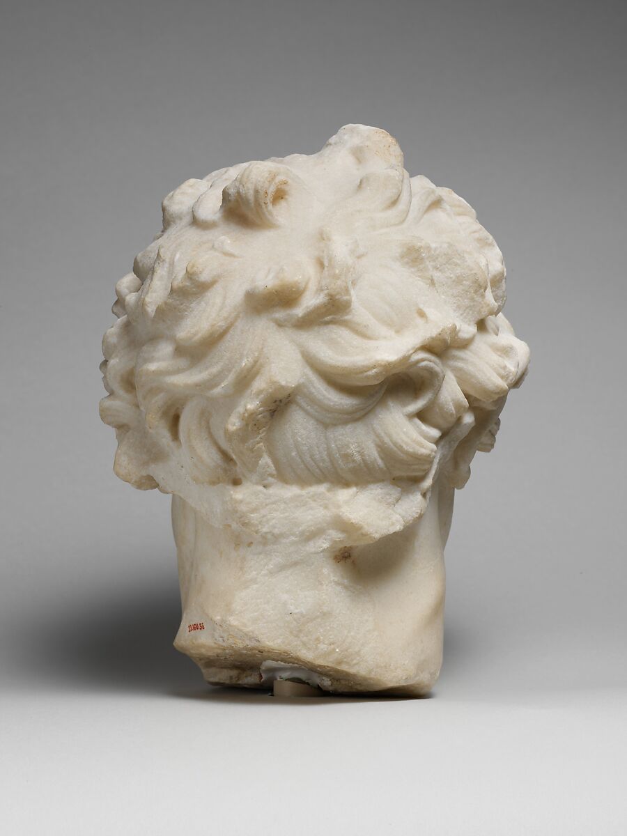 Marble head of a satyr playing the double flute, Marble, Roman