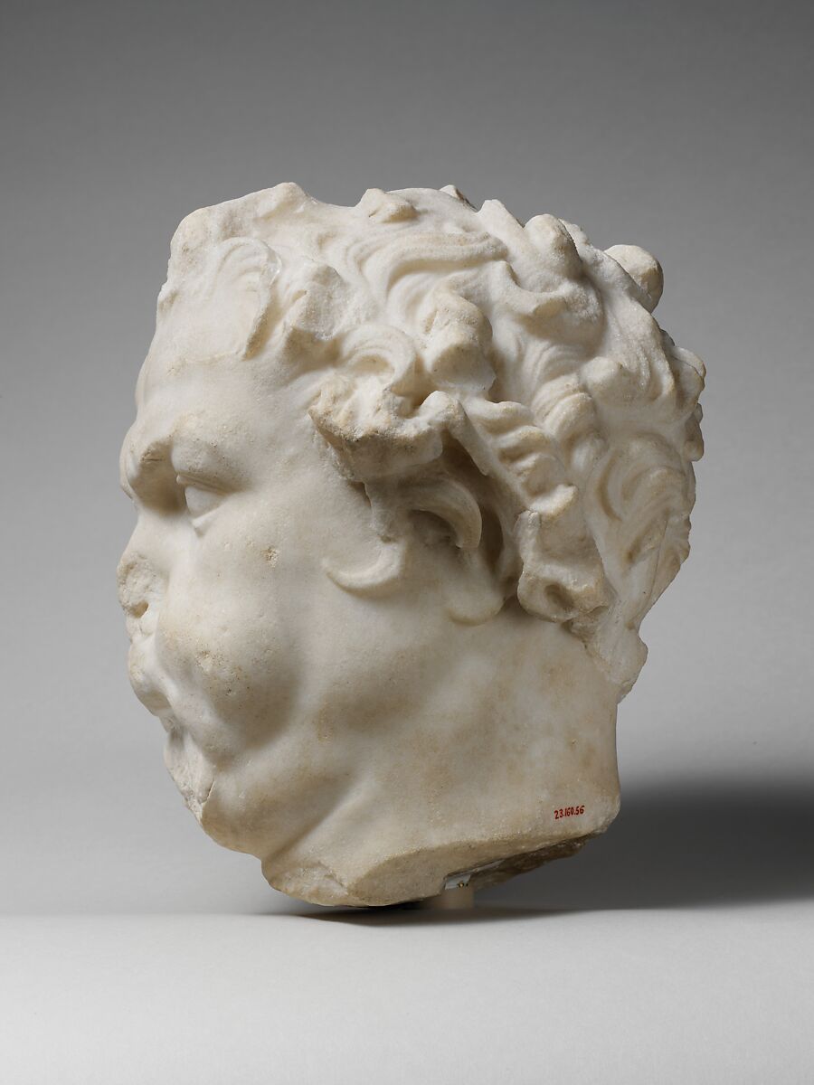 Marble head of a satyr playing the double flute, Marble, Roman