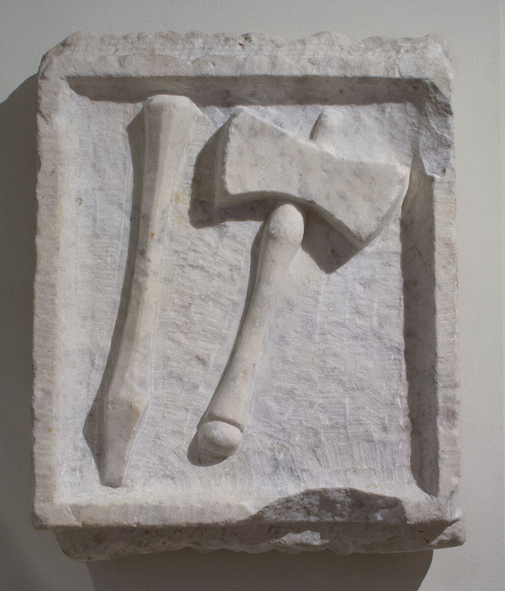 Marble relief of a chisel and mallet, Marble-Italian ?, Roman 