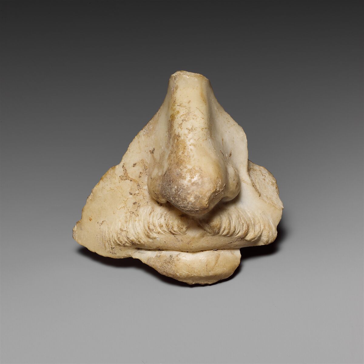 Fragment from a marble head of a man, preserving the nose and mouth, Marble, Roman 