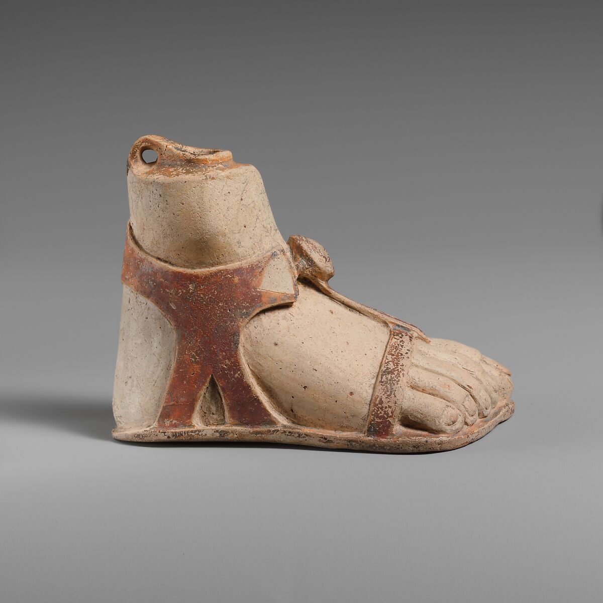 Terracotta aryballos (perfume vase) in the form of a sandaled right foot, Terracotta, Rhodian 