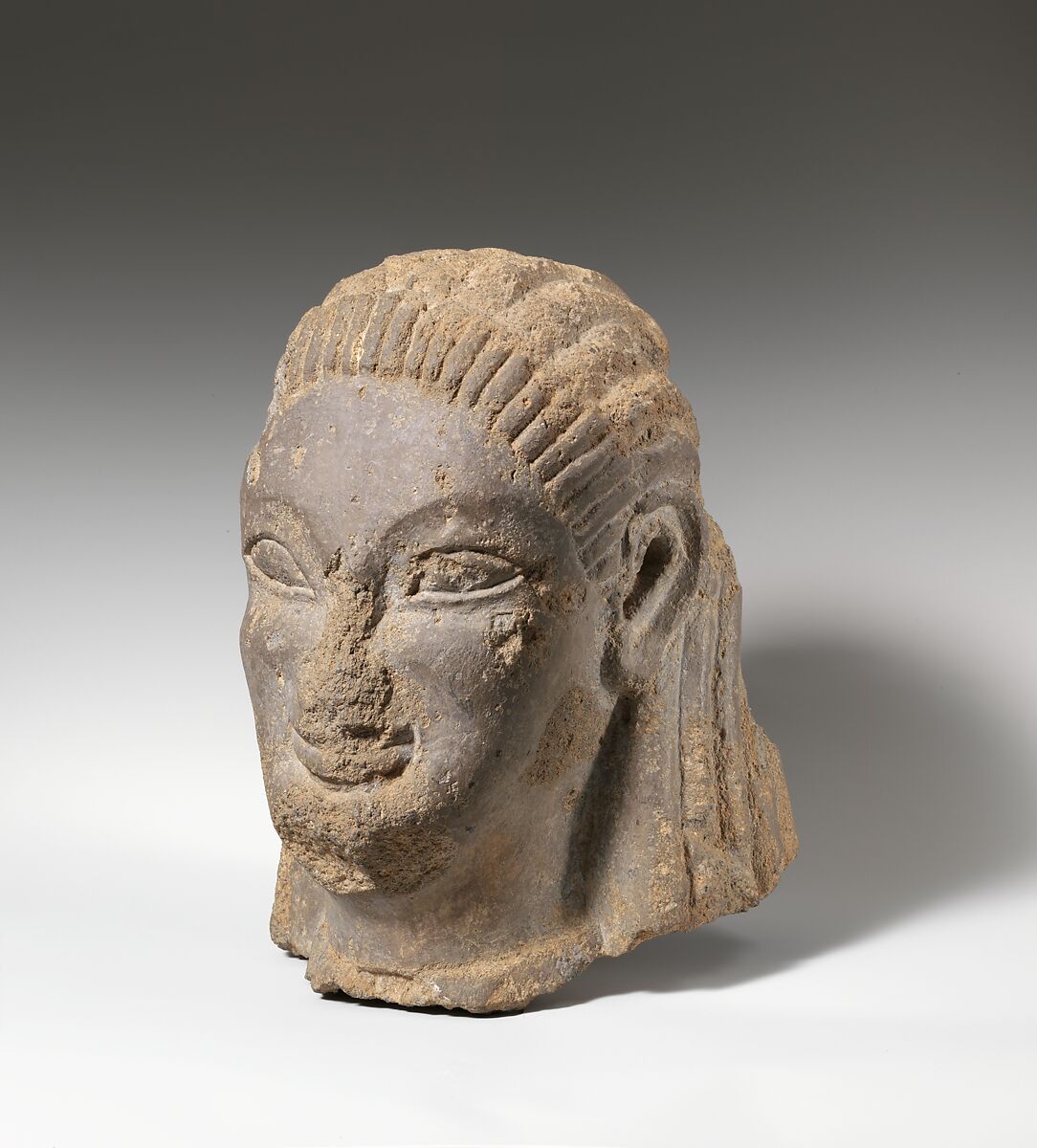 Tufa head of sphinx or siren, Tufa, Etruscan, probably Vulcian 