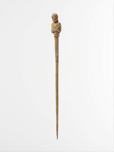 Bone hairpin with bust of a woman