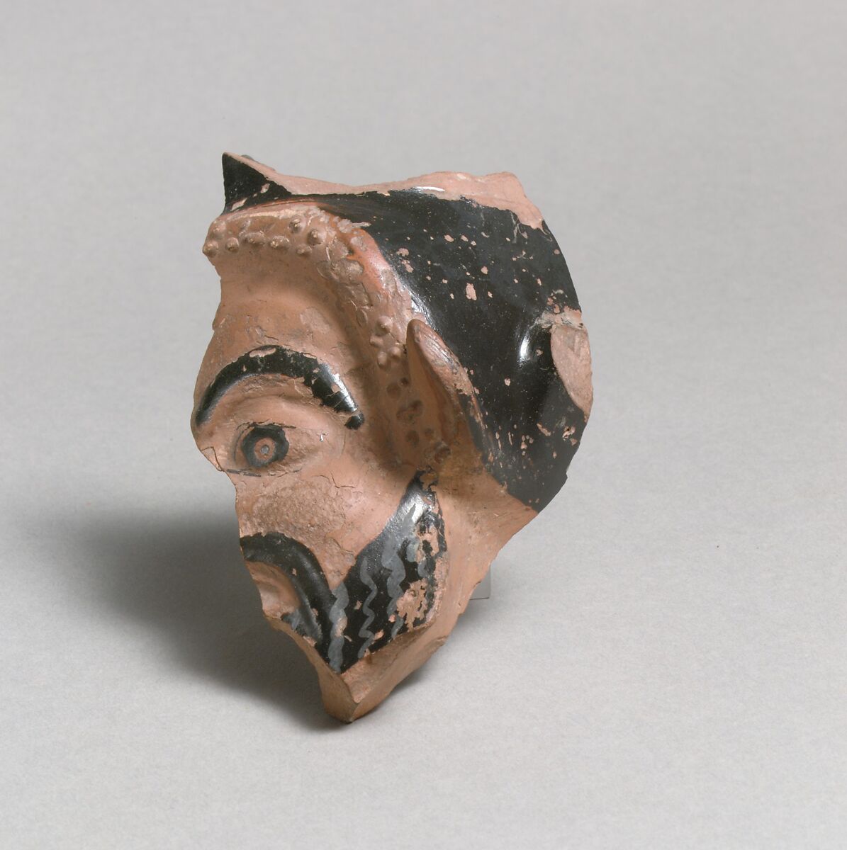 Vase fragment in the form of a satyr's head, Attributed to the Class O: The Sabouroff Class of Head Vases, Terracotta, Greek, Attic 