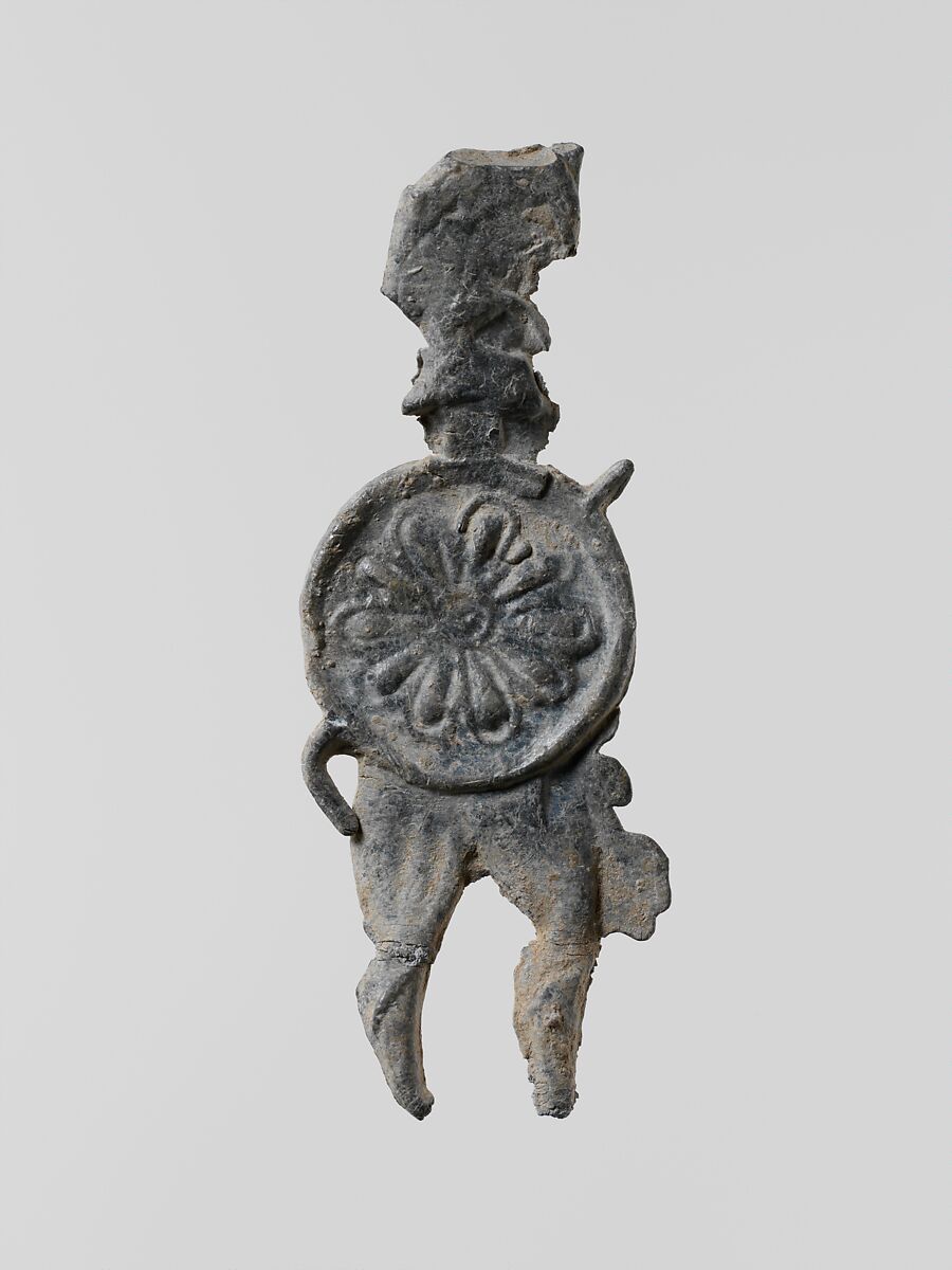 Lead figure of a warrior with a helmet, shield, and spear, Lead, Greek, Laconian 