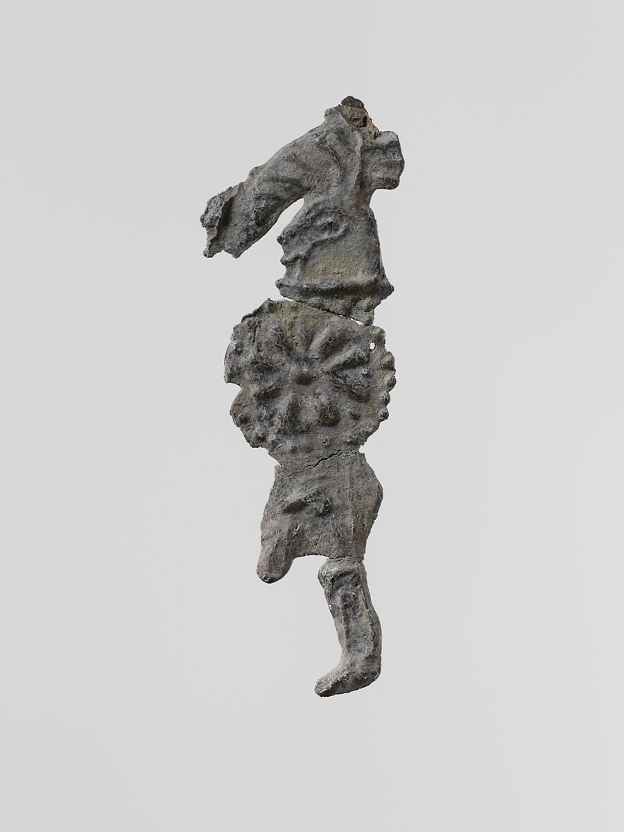 Lead figure of a warrior with a helmet and shield, Lead, Greek, Laconian 