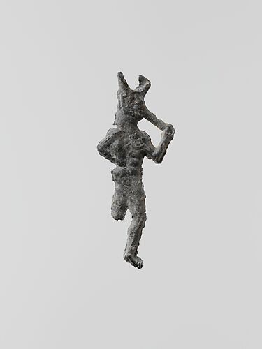 Lead figure of a flute-player