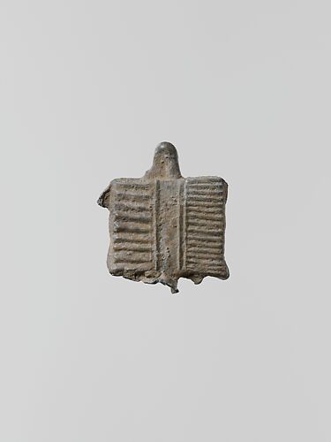 Lead ornament, possibly in the form of a comb
