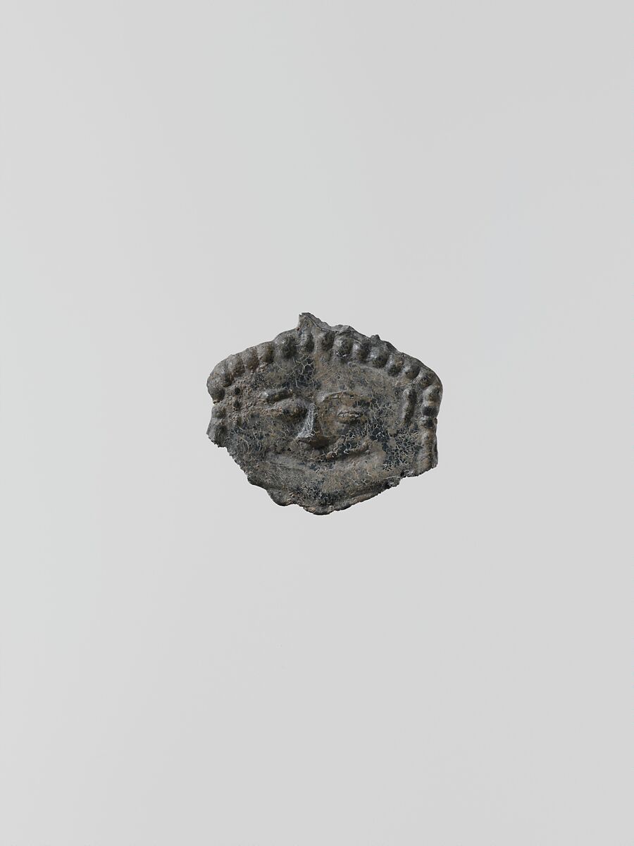 Lead ornament in the form of a gorgoneion (gorgon's face), Lead, Greek, Laconian 