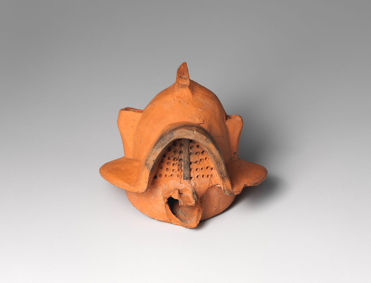 Terracotta lamp in the form of a gladiator’s helmet, Terracotta, Roman 