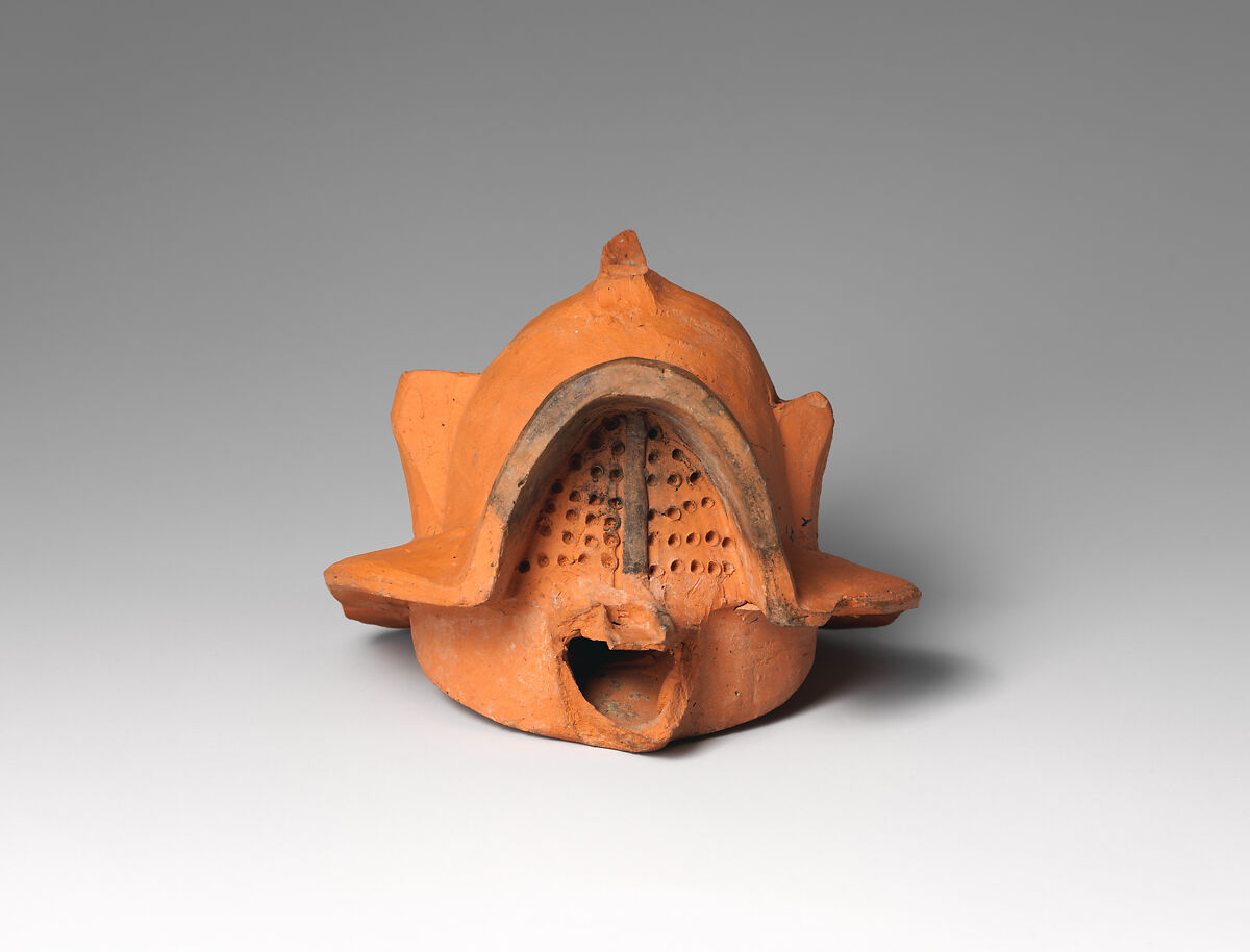 Terracotta lamp in the form of a gladiator’s helmet, Terracotta, Roman