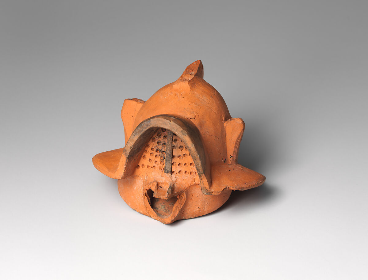 Terracotta lamp in the form of a gladiator’s helmet, Terracotta, Roman