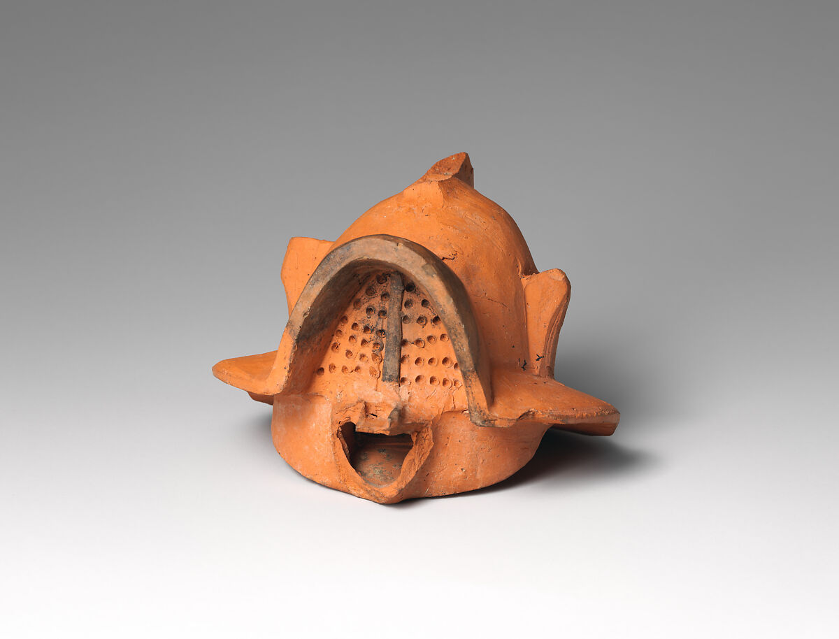 Terracotta lamp in the form of a gladiator’s helmet, Terracotta, Roman