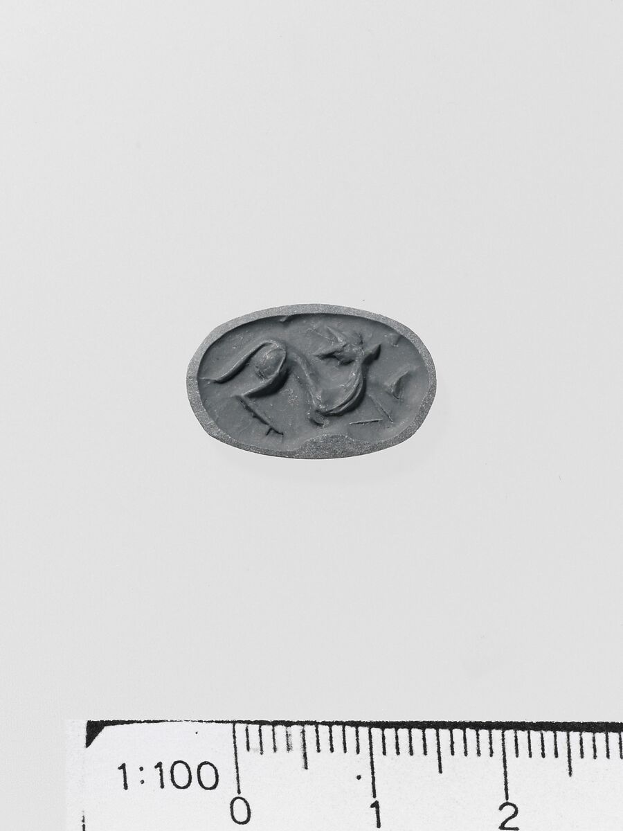 Steatite triangular prism, Serpentine (burnt), Minoan