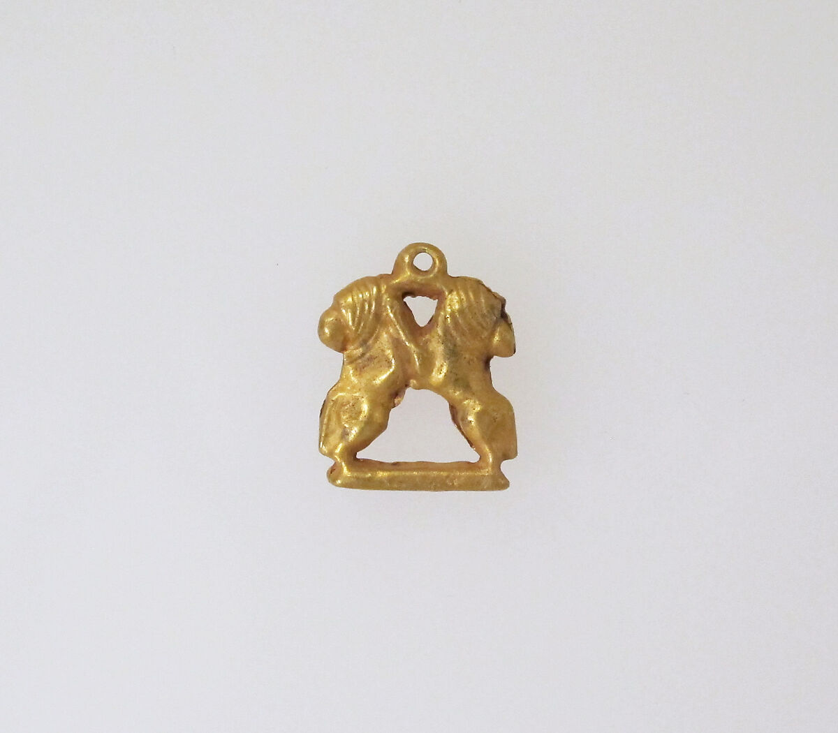 Gold pendant in the form of two rampant lions, Gold, Minoan