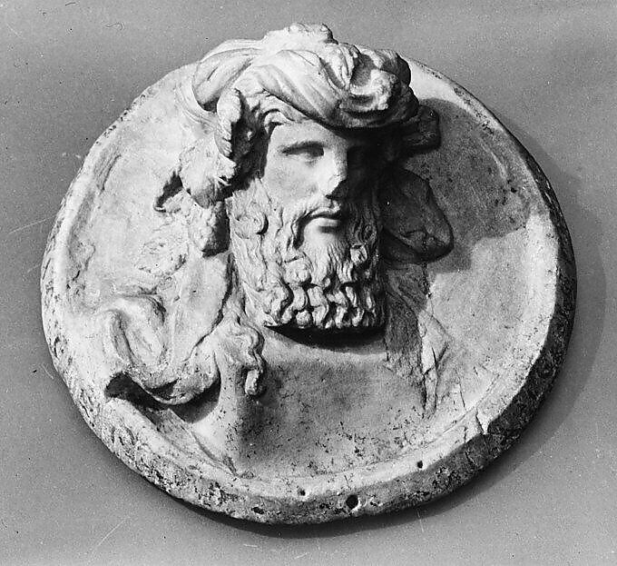 Marble disk with a herm of Dionysus in relief, Marble, Roman