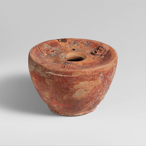 Terracotta inkwell and bronze stylus