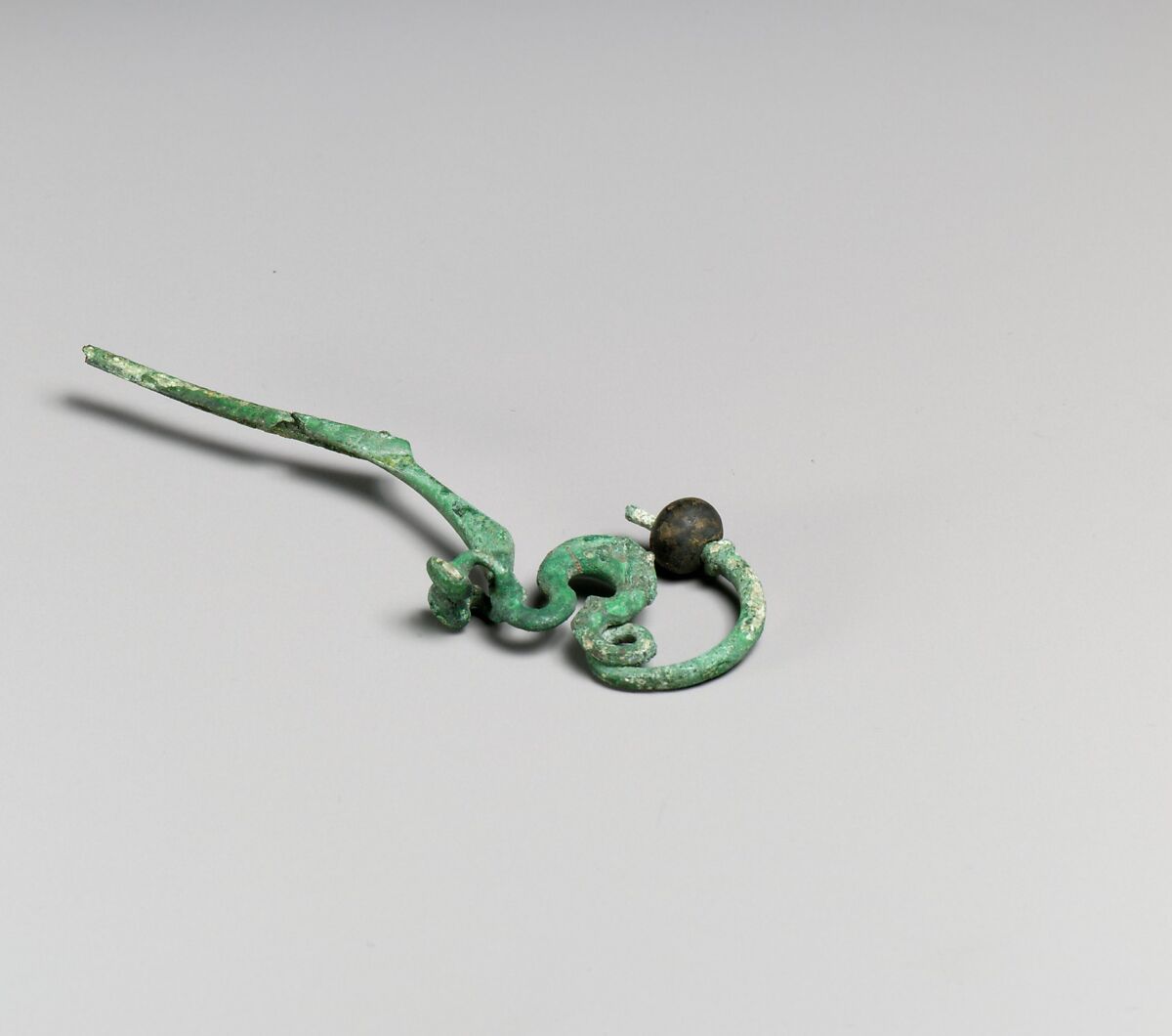 Fibula, serpentine type, Bronze, Etruscan 