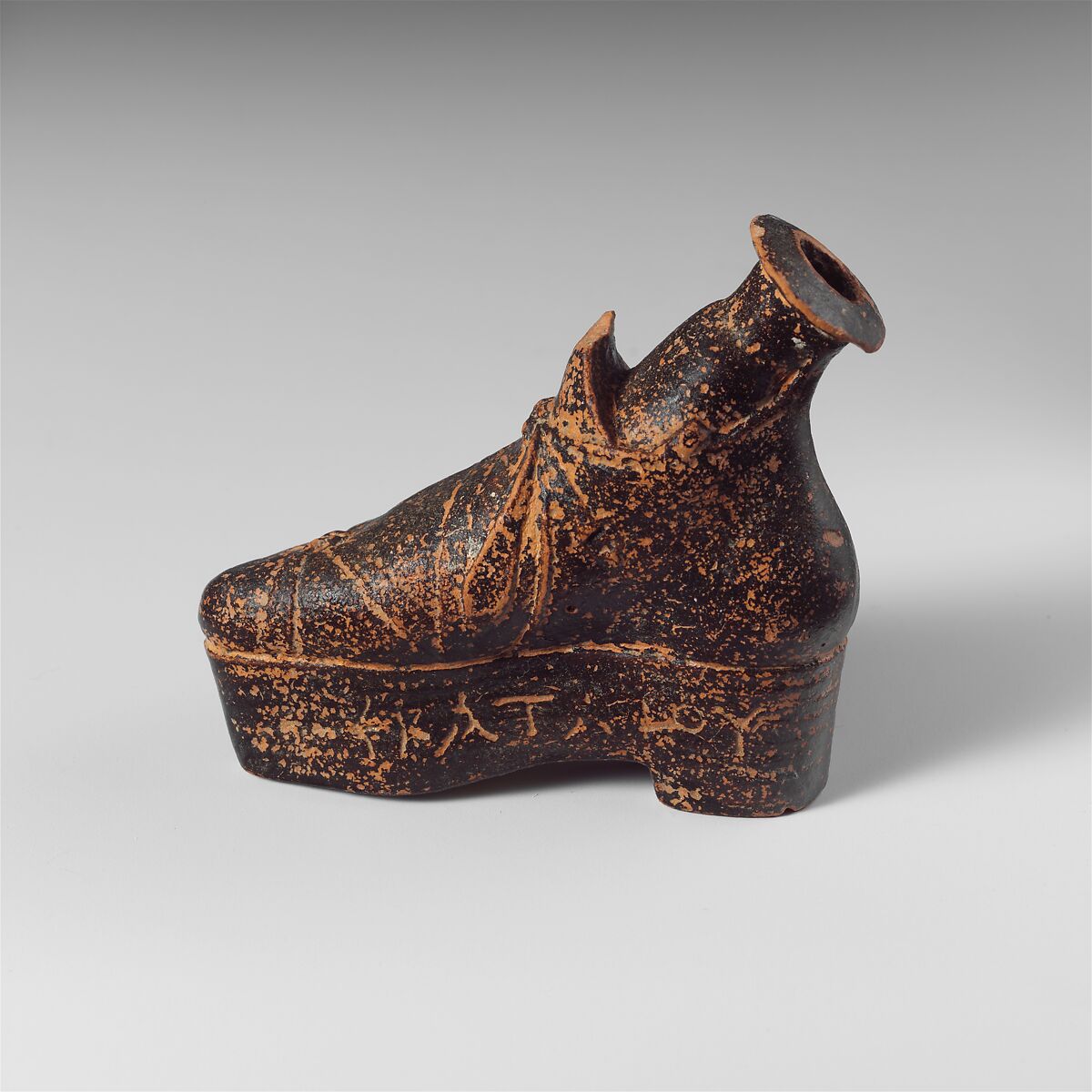 Terracotta perfume flask in the shape of a shoe, Terracotta, Lydian 