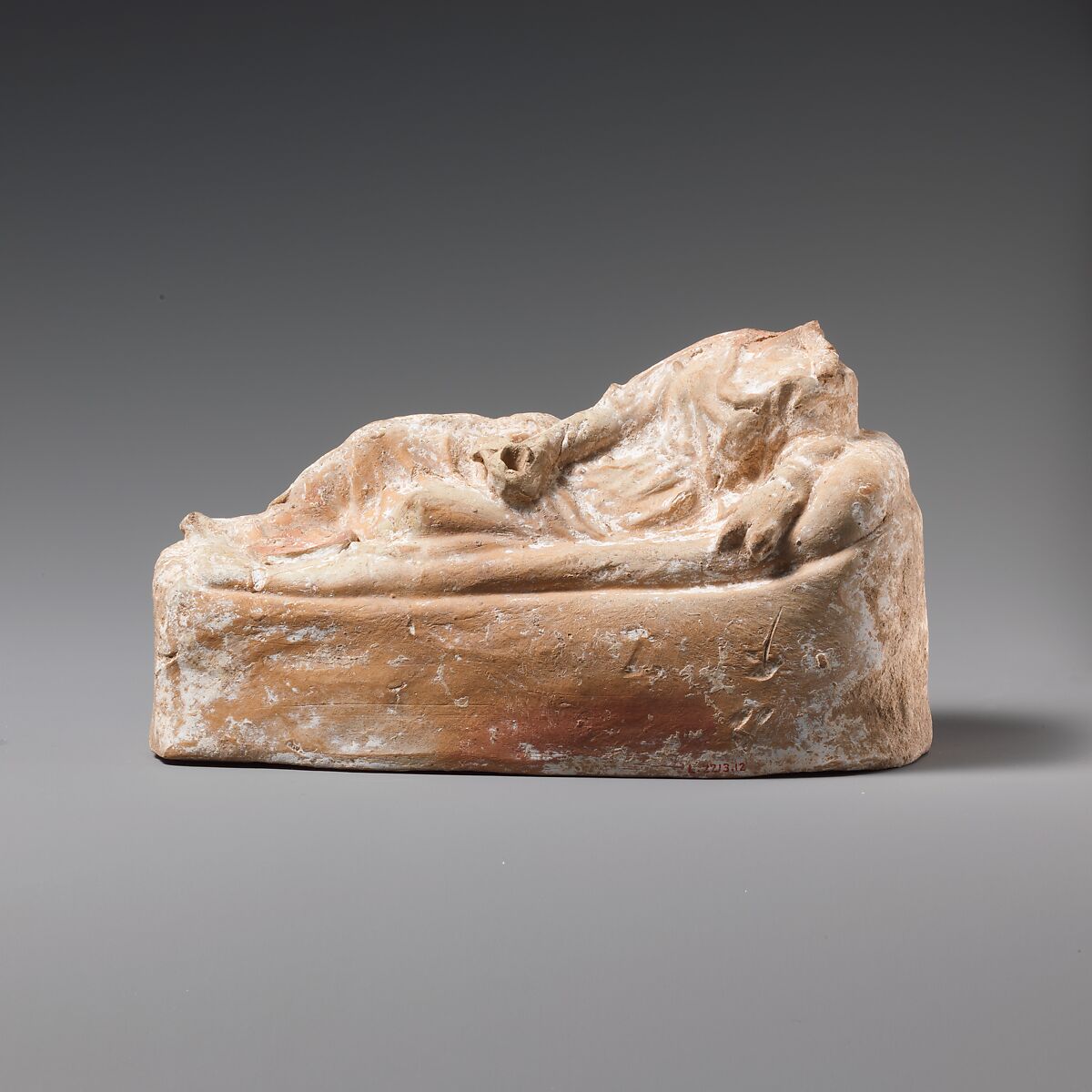 Terracotta statuette of a woman reclining on a couch, Terracotta, East Greek 