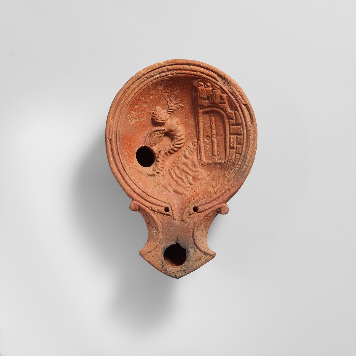 Terracotta volute lamp with sea monster, Terracotta, Roman 