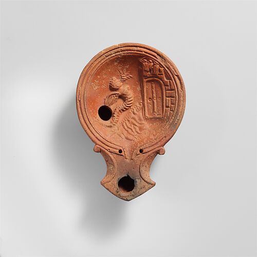 Terracotta volute lamp with sea monster