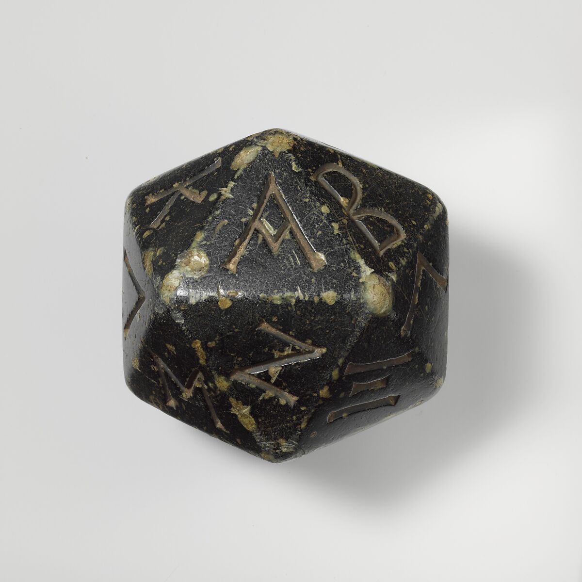Greenstone polyhedron inscribed with letters of the Greek alphabet, Greenstone, Greek 